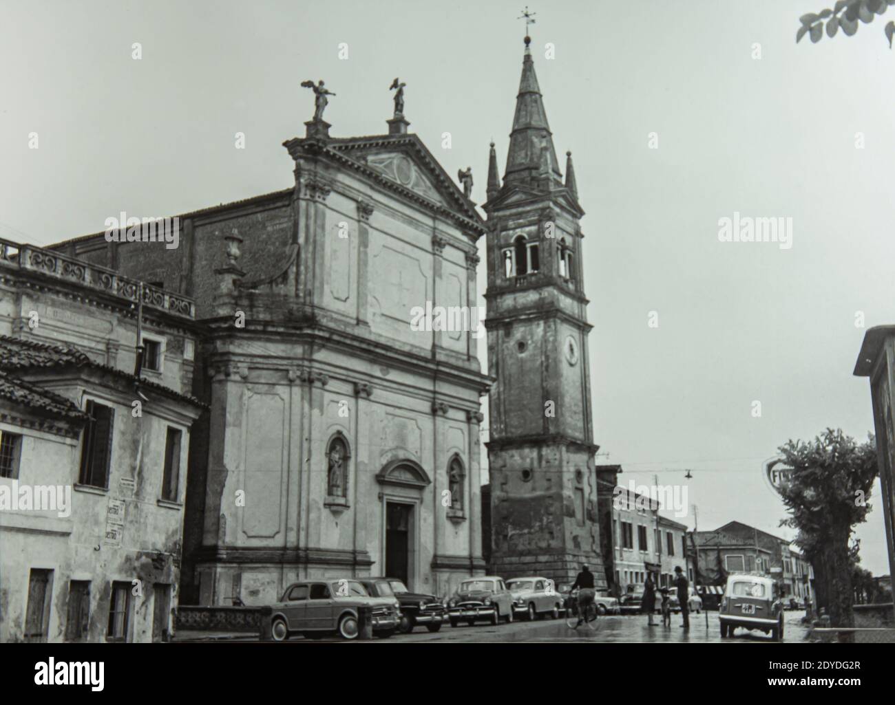 VILLANOVA DEL GHEBBO, ITALY 14 OCTOBER 1967: Villanova del Ghebbo square and church in Italy in 60s Stock Photo