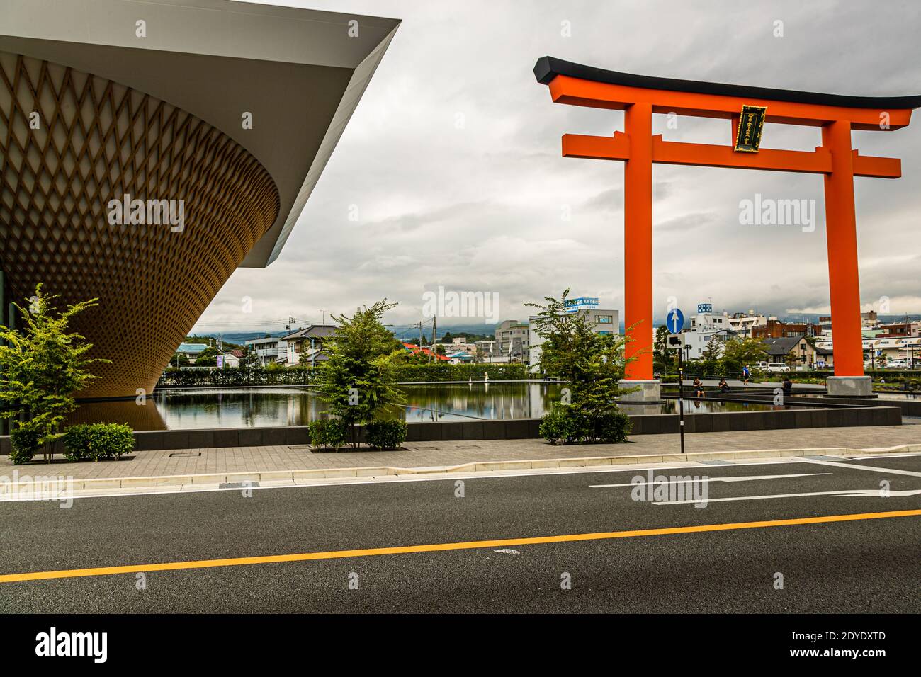 The Mount Fuji World Heritage Centre in Fujinomiya, Japan. The cone-shaped building is based on the shape of the volcano, was turned upside down and is reflected as Mount Fuji on the water surface in front of the museum. Stock Photo