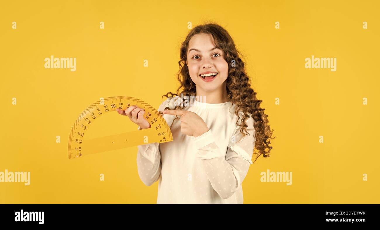 math. exact sciences. girl with protractor and triangle ruler. back to school. Geometry favorite subject. Education and school concept. School student learning geometry. Stock Photo