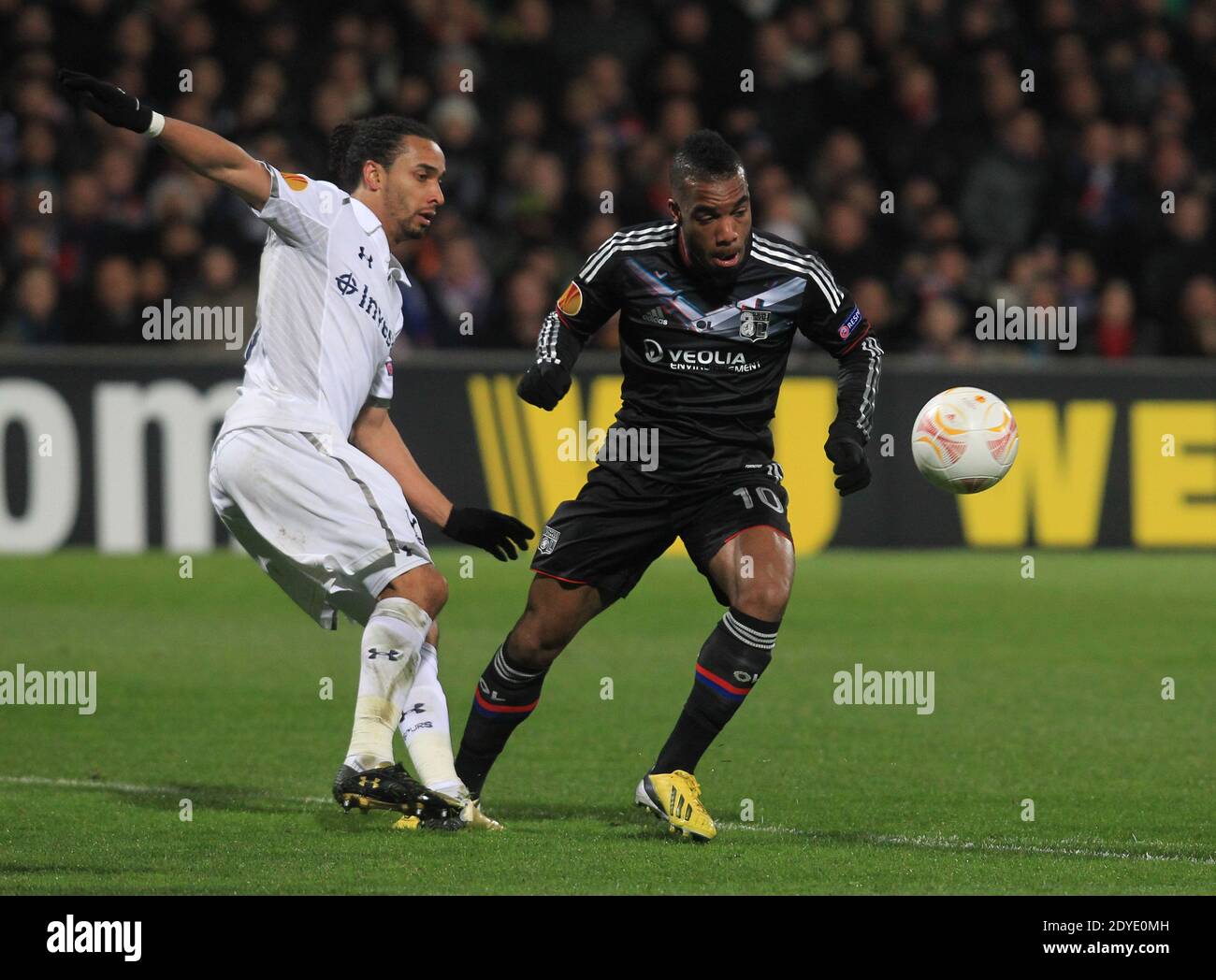 Lyon's Alexandre Lacazette and Tottenham's Benoit Assou-Ekotto during the Europa League soccer match, Olympique Lyonnais Vs Tottenham Hotspur FC at the Gerland stadium in Lyon, France on February 21, 2013. The match ended in a 1-1 draw. Photo by Vincent Dargent/ABACAPRESS.COM Stock Photo
