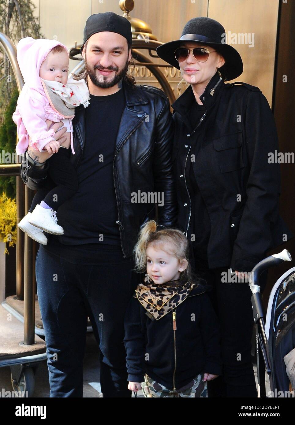 DJ superstar and producer Steve Angello with his wife the famous swedish  model Isabel Adrian and their two children leaving the Trump soho hotel in  New York, on March 5, 2013. Photos