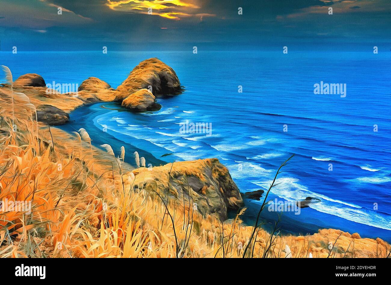 Golden grass on a hill next to the ocean with wunset in the background Stock Photo