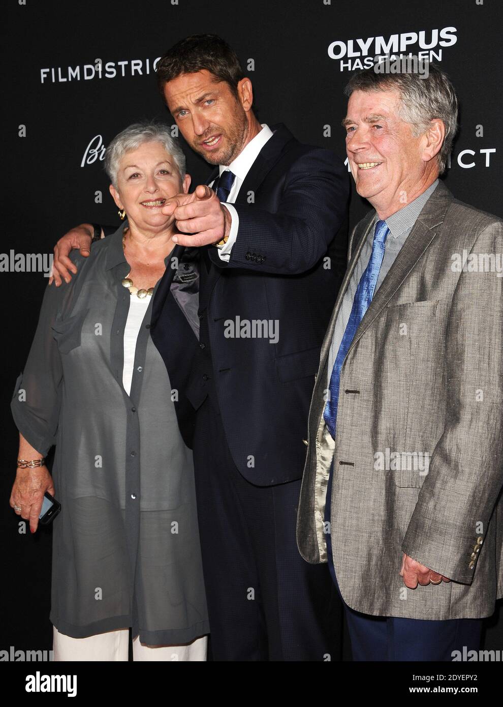 Gerard Butler and his parents attend the premiere of Olympus Has Fallen