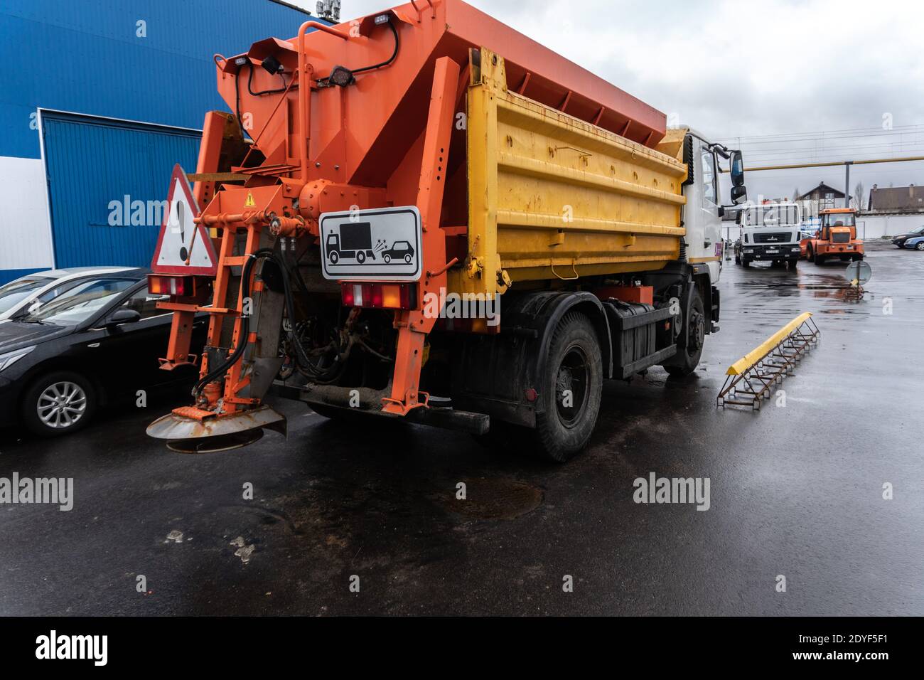 Snow removal equipment sprinkling the road with sand and salt Stock Photo Alamy