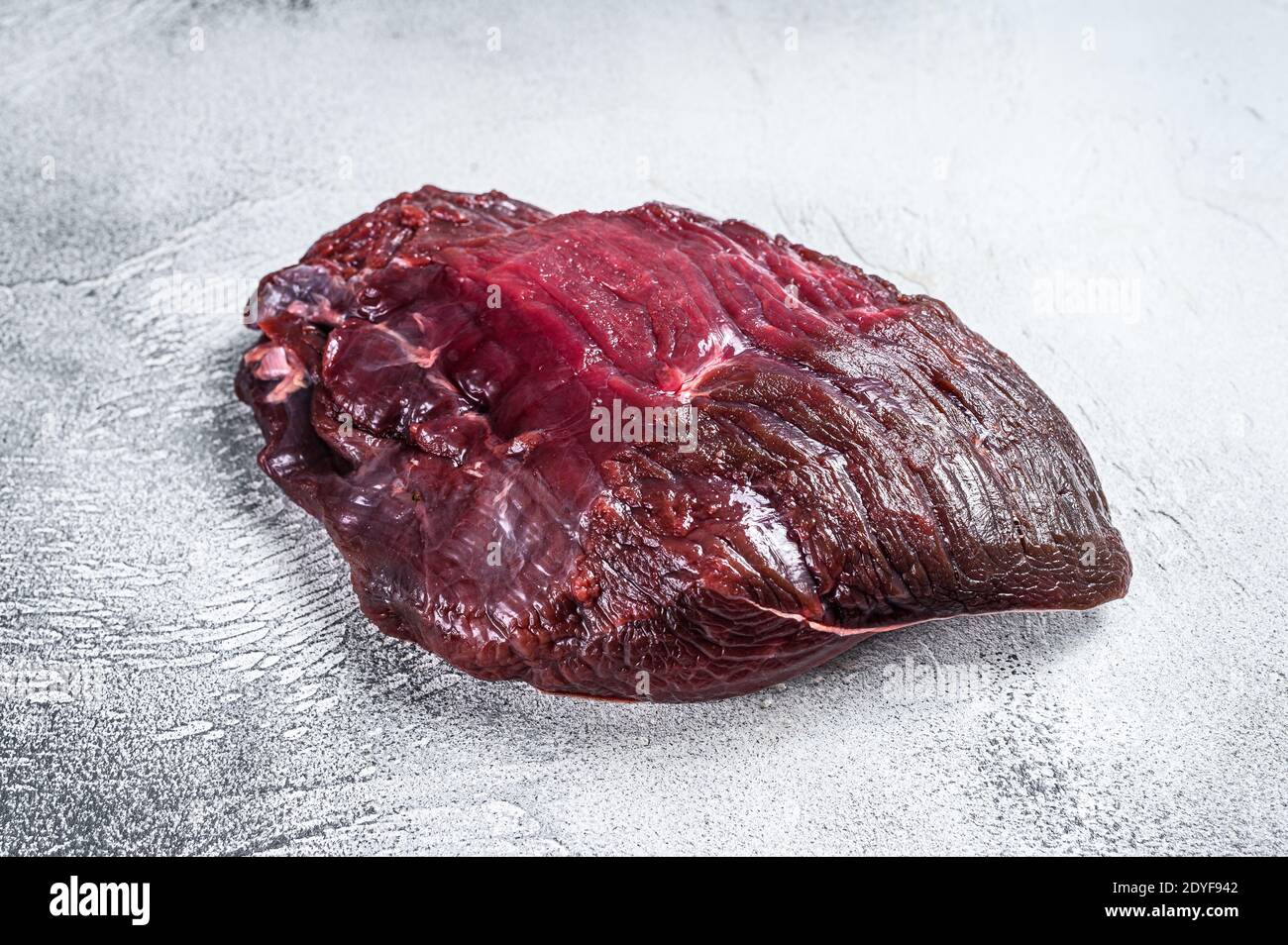 Venison raw deer meat on a table. White background. Top view Stock Photo -  Alamy