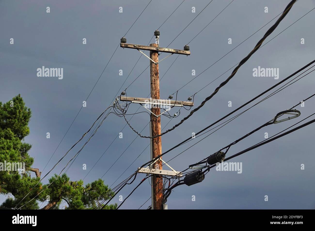 Electrical and telephone power lines in California, USA.  Lines operated by the Pacific Gas and Electricity Company   (PG&E) considered by many to be Stock Photo