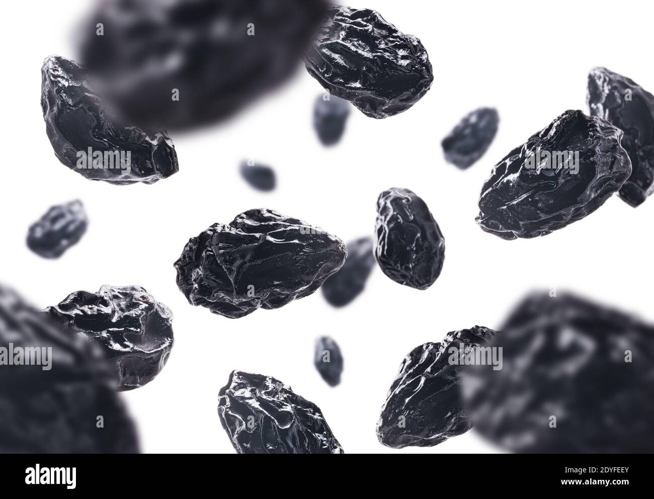 Dried prunes levitate on a white background Stock Photo Alamy