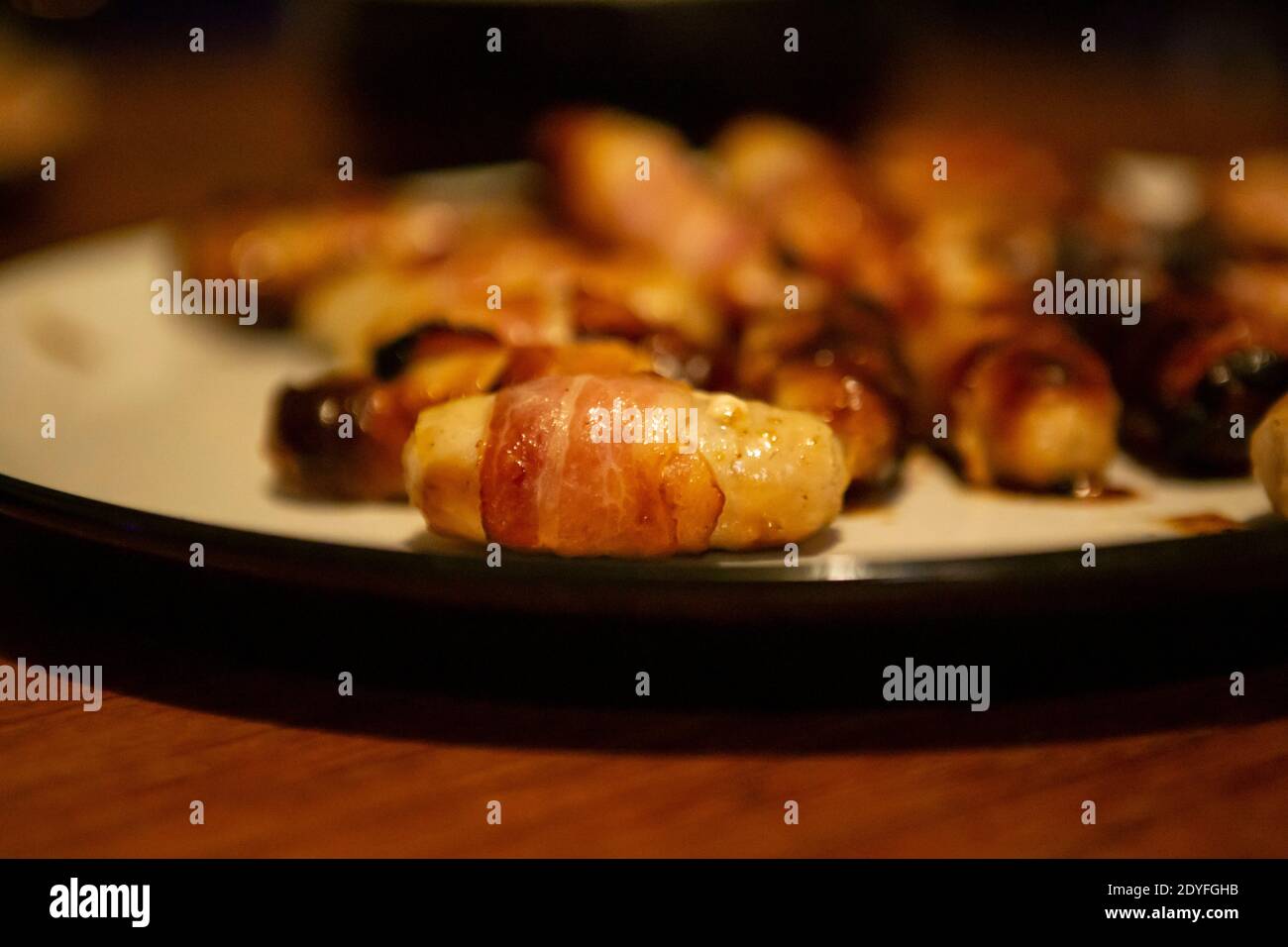Pigs in blankets on a plate Stock Photo