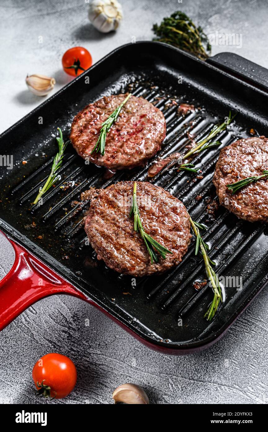 Grilled ground beef patties. BBQ Mince meat. White background. Top view