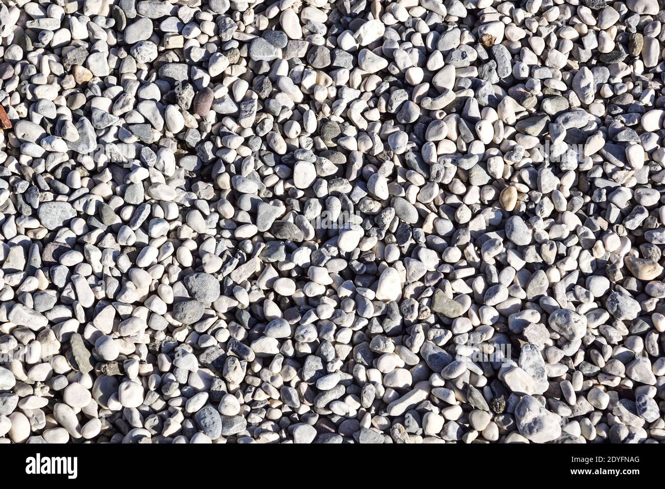 Stone pebbles texture background for interior exterior decoration and industrial construction concept design. Stock Photo
