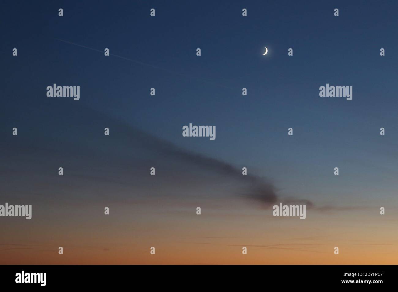 Sky with moon in afterglow, Hamburg, Germany Stock Photo