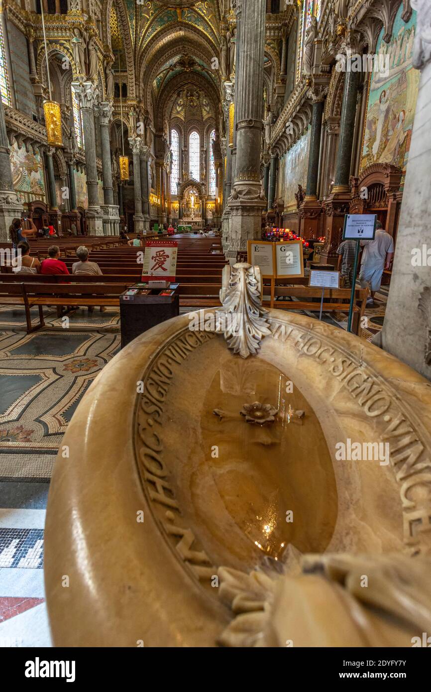 The baptismal font at the entrance to the Basilica of Notre Dame de Fourvière. Lyon, France, Europe Stock Photo
