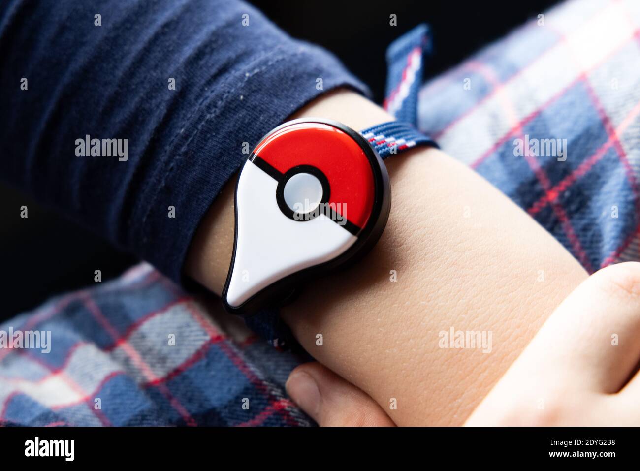 Childs Hand With New Japanese Game Pokemon Go Plus Made By The Pokemon Company Nintendo Addictive Popular Activity Among Children And Grownups Stock Photo Alamy