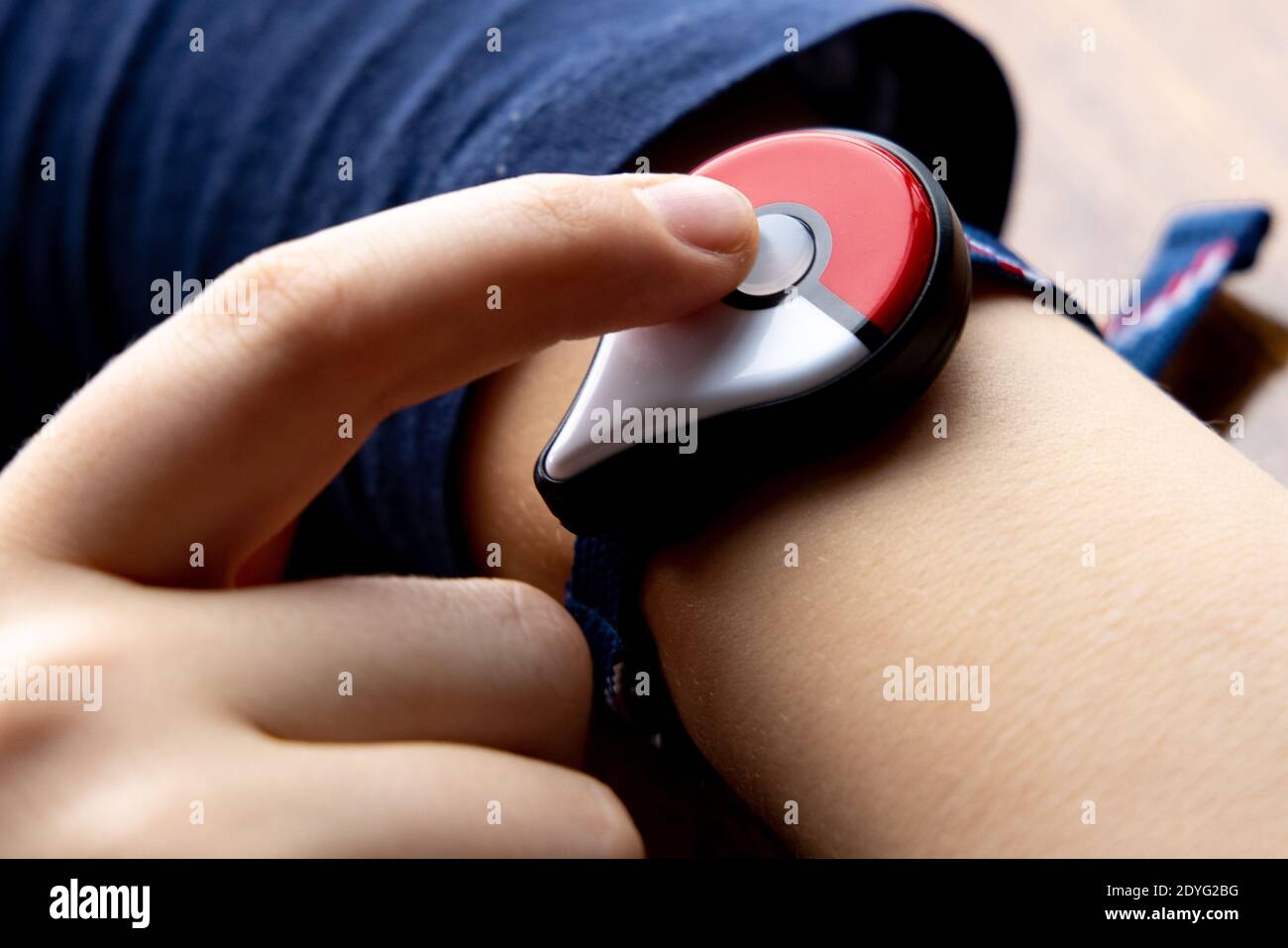 Childs Hand With New Japanese Game Pokemon Go Plus Made By The Pokemon Company Nintendo Addictive Popular Activity Among Children And Grownups Stock Photo Alamy