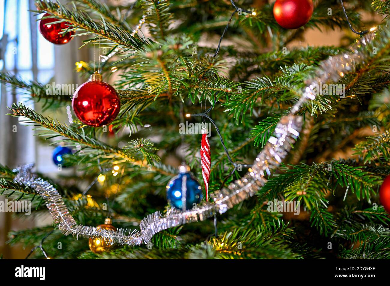 christmas tree full with colorful and decorative balls Stock Photo - Alamy