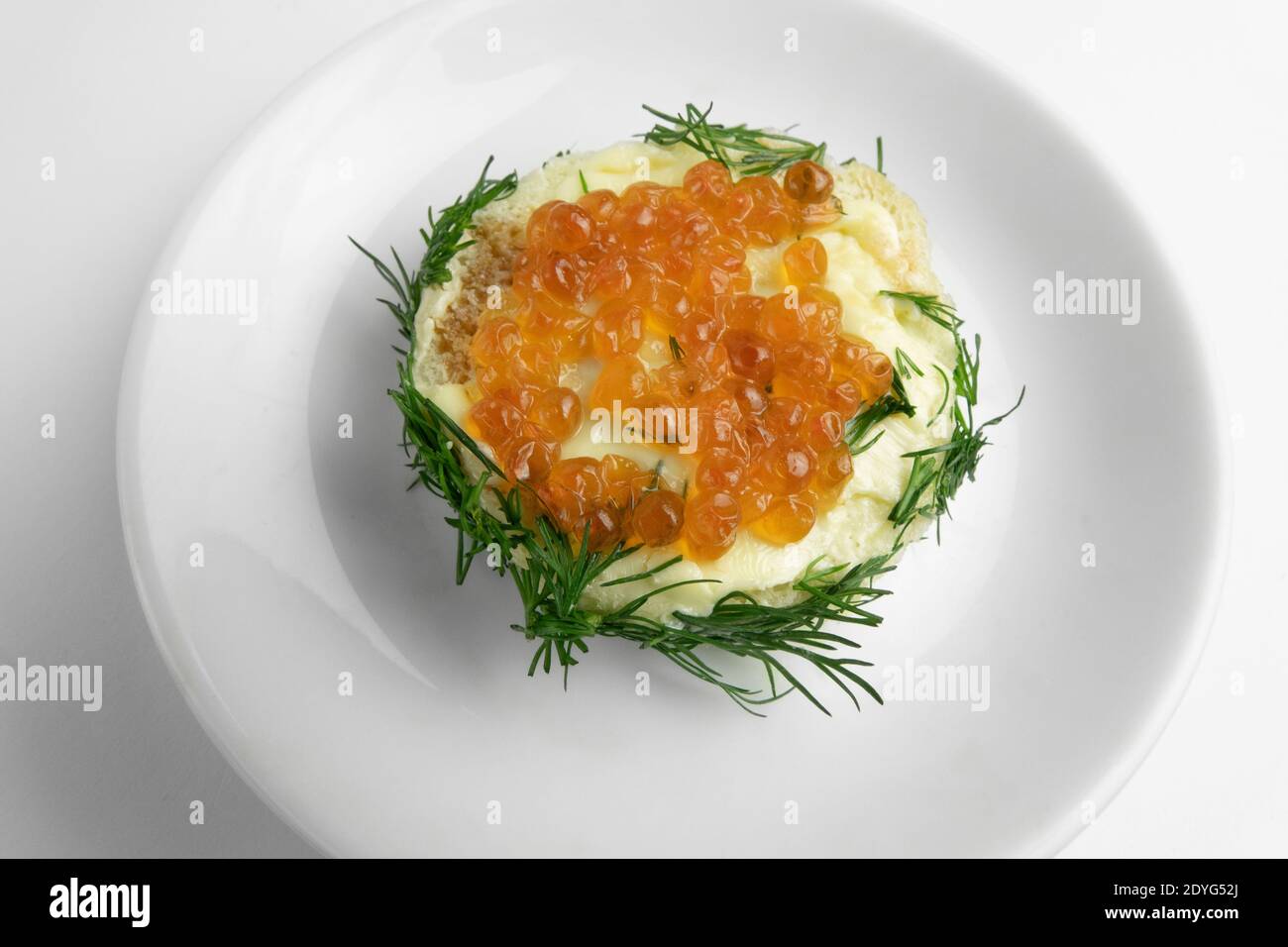 Kanapes with butter and red caviar Stock Photo