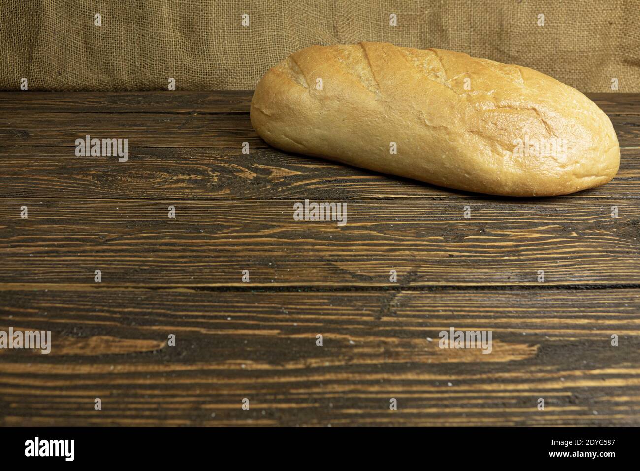 Fresh handmade bread on wooden background Stock Photo