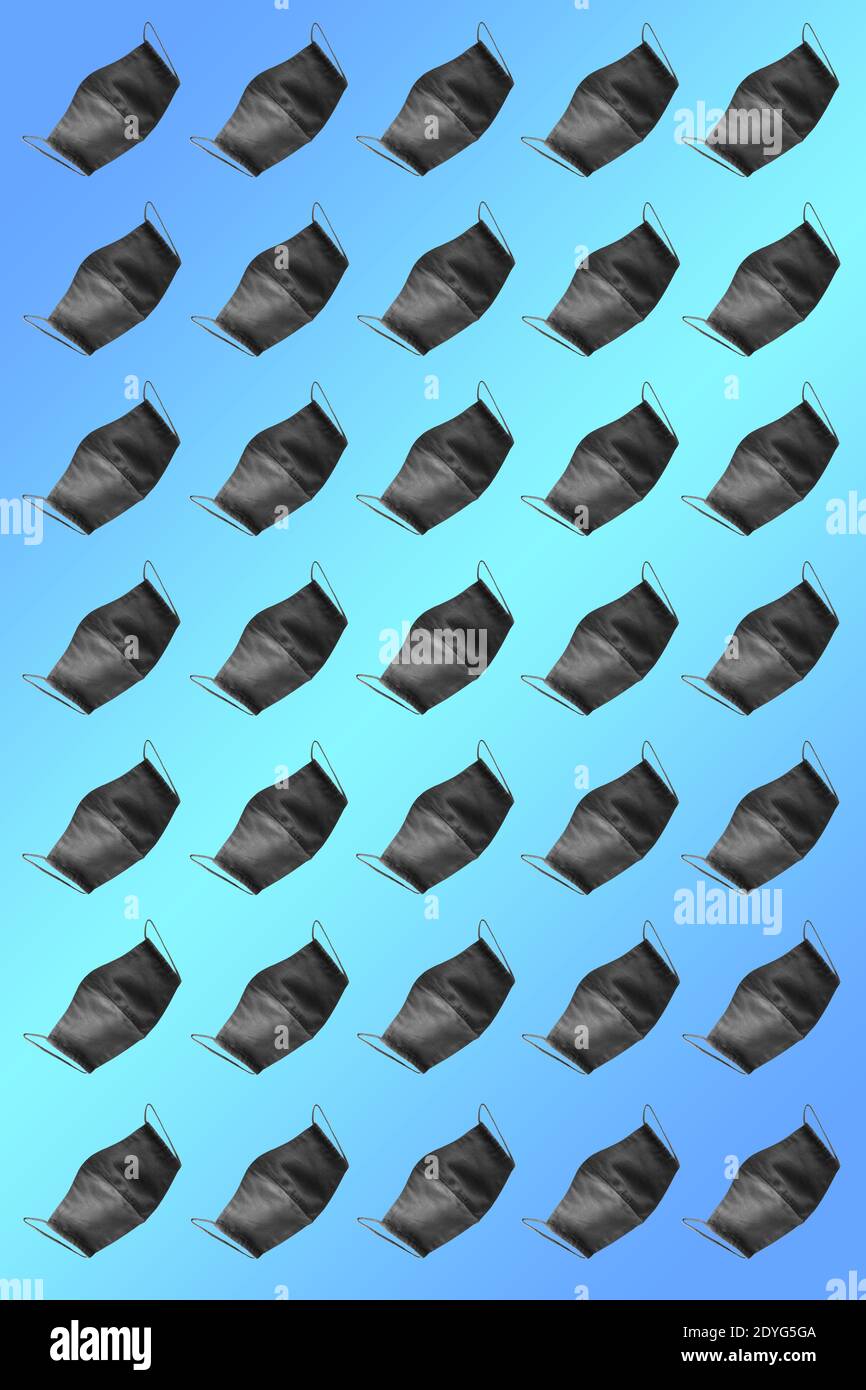 Protective mask pattern. Face protective masks pattern isolated on gradient background. Many black medical masks on the multicolored background. Medic Stock Photo