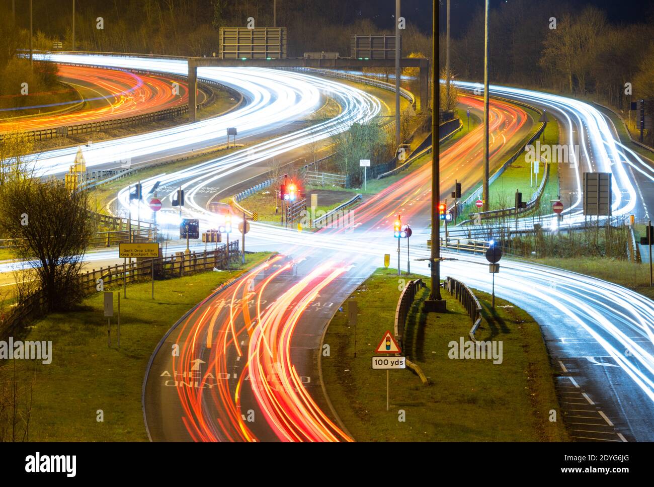 The Bredbury Scissors or Lower Bredbury Interchange, junction 26 of the M60 motorway, England, UK. Light trails, night photo, long exposure Stock Photo