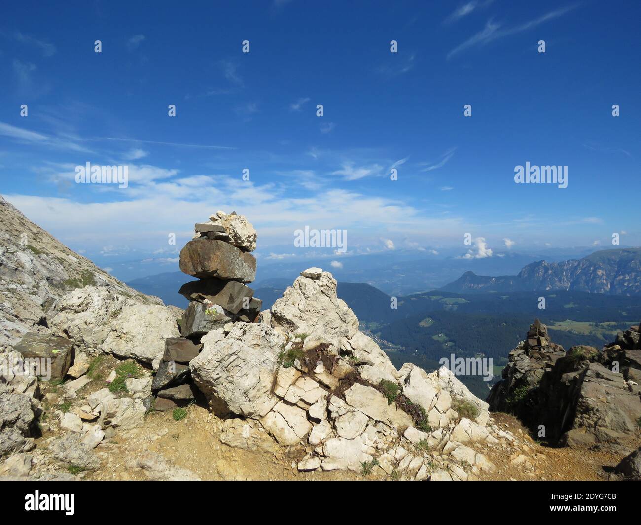 A closeup of rocks and stones in Dolomite Alps, stunning mountain view in the background Stock Photo