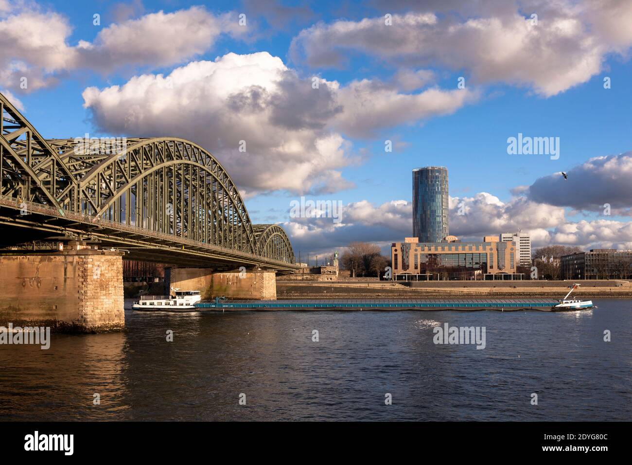 view over the river Rhine to the Hohenzollern bridge, the CologneTriangle skyscraper and the Hyatt Hotel in the district Deutz, Cologne, Germany.  Bli Stock Photo