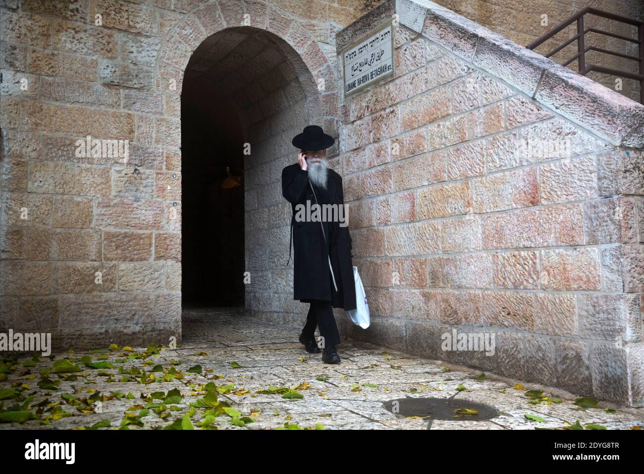 Hurva Square Jewish man walking in the downtown of Jerusalem city at Hurva square ...