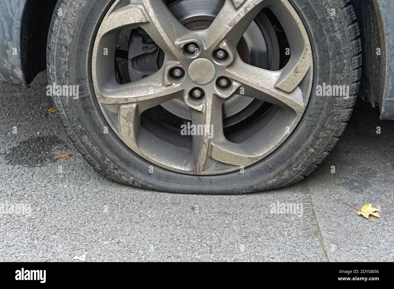 Flat tire deflated pneumatic car tyre wheel Stock Photo Alamy