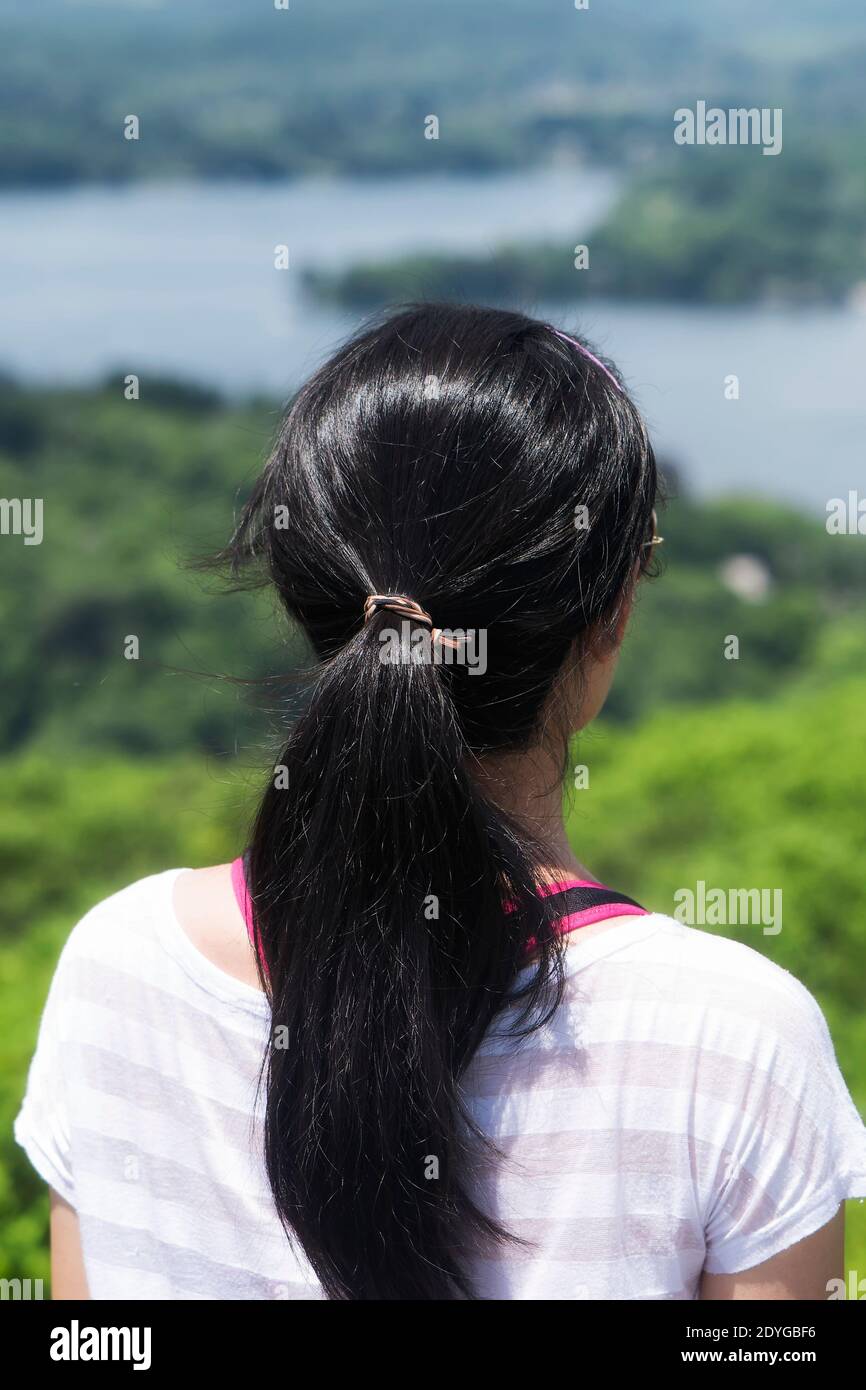 A chinese woman with black hair looking out over Lake Waramaug from the top of the pinnacle on the macricostas preserve in New Preston Connecticut Stock Photo - Alamy A chinese woman with black hair looking out over Lake Waramaug from the top of the pinnacle on the macricostas preserve in New Preston Connecticut Stock Photo - Alamy