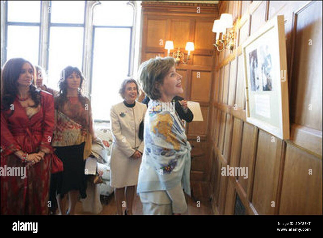 Laura Bush and Cristina Kirchner look over Eva Perón photographic exhibit. Stock Photo