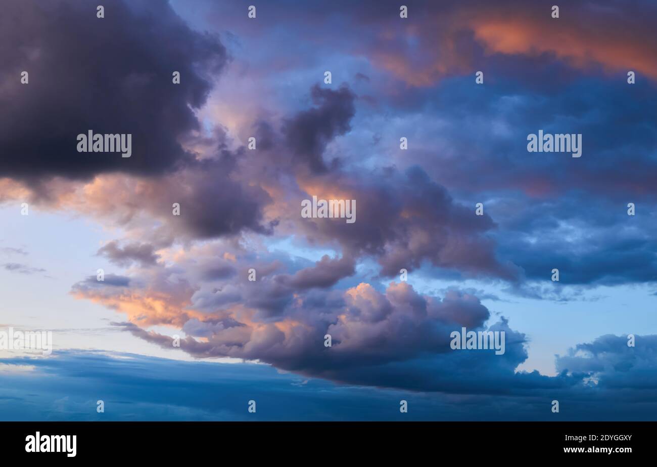 sunset stormy sky with beautifully illuminated clouds Stock Photo - Alamy
