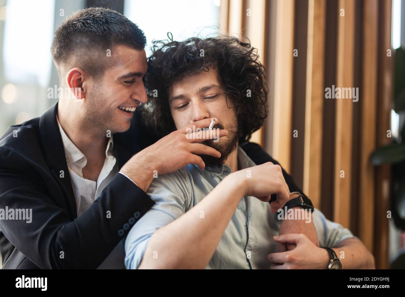 Two Male Friends Laughing In An Istanbul Cafe Stock Photo