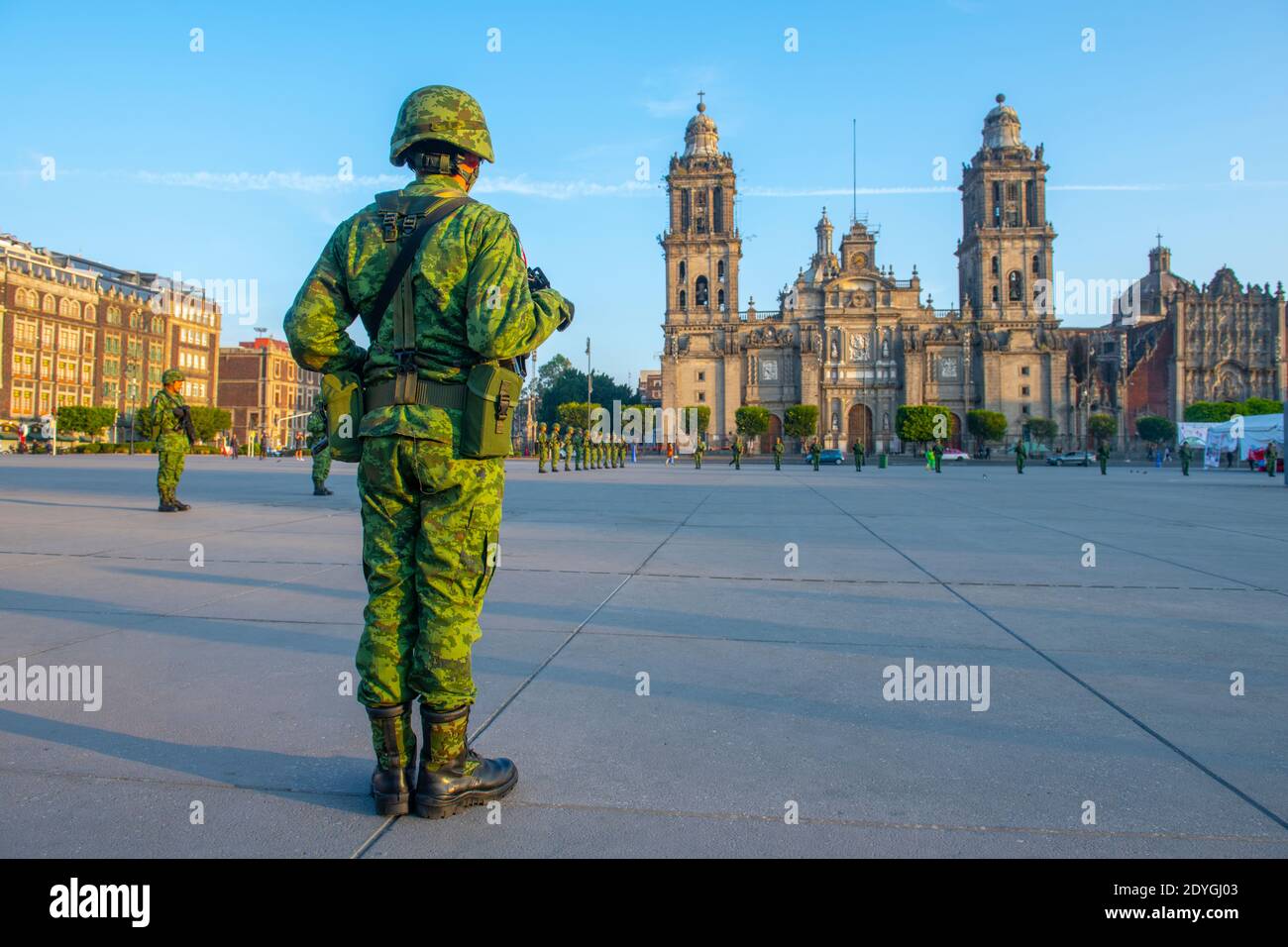 Raising Flag Guard of Honor stand on Zocalo in front of Metropolitan Cathedral at Historic center of Mexico City CDMX, Mexico. Stock Photo
