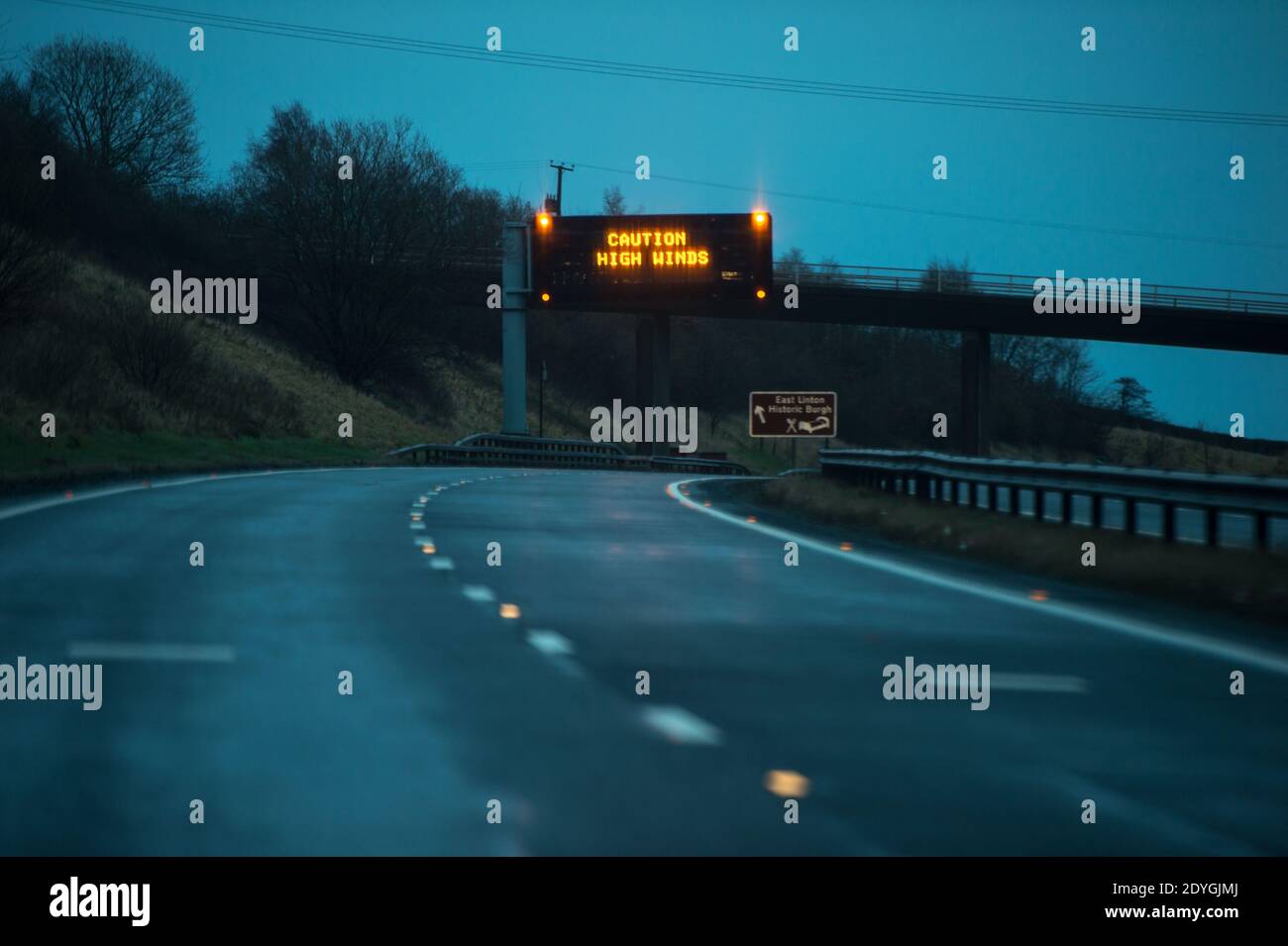 Edinburgh and Central Scotland, Scotland, UK. 26th Dec, 2020. Pictured: Motorway road signs advising high winds, and extreme weather, with MET Office issuing a Yellow ‘risk to life' weather alert. Forecasters have predicted up to 80mph winds and potentially more than three inches of rain in parts of the UK as Storm Bella crashes into Britain. Credit: Colin Fisher/Alamy Live News Stock Photo