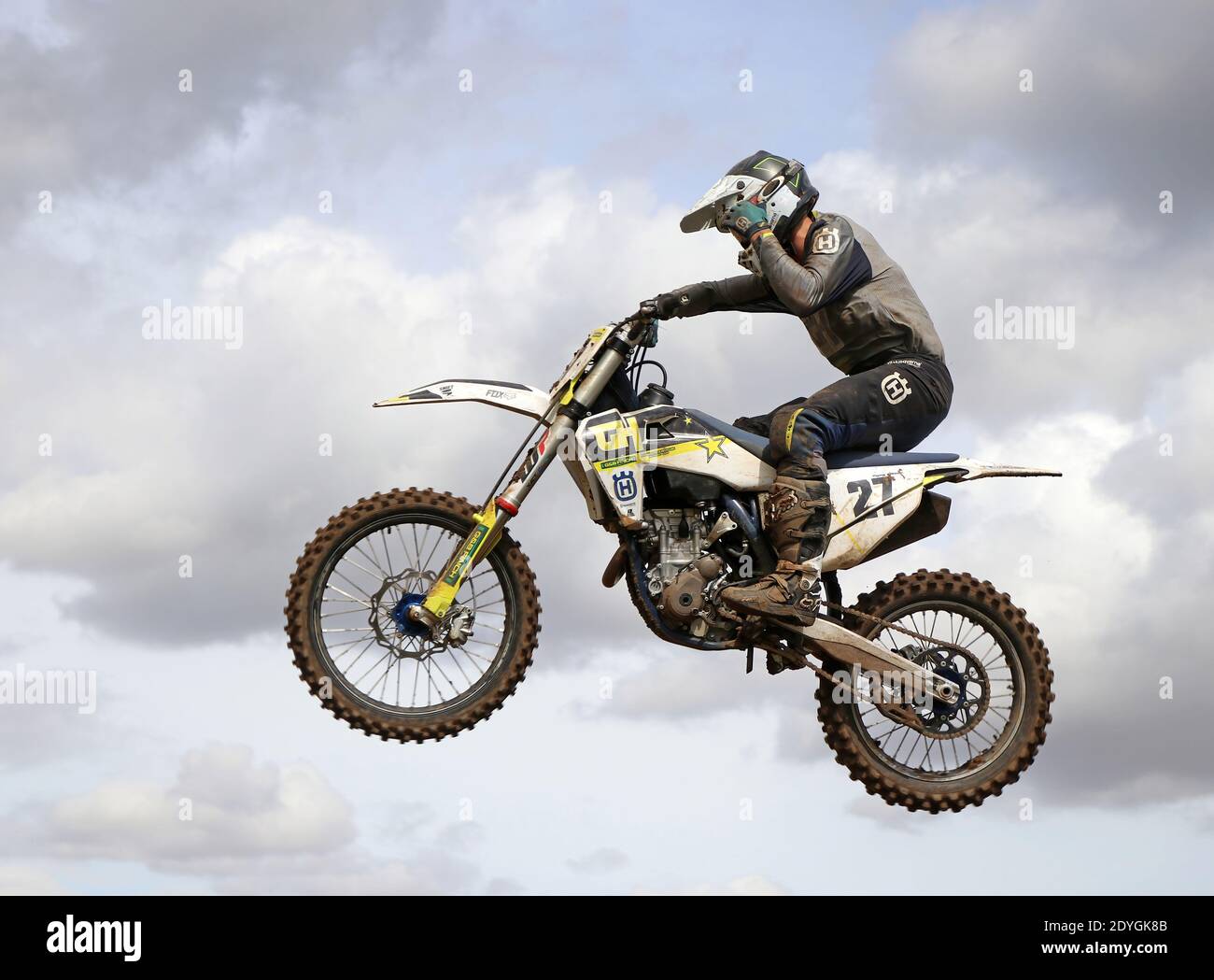 solo motorbike  rider flying through the air on a jump Stock Photo