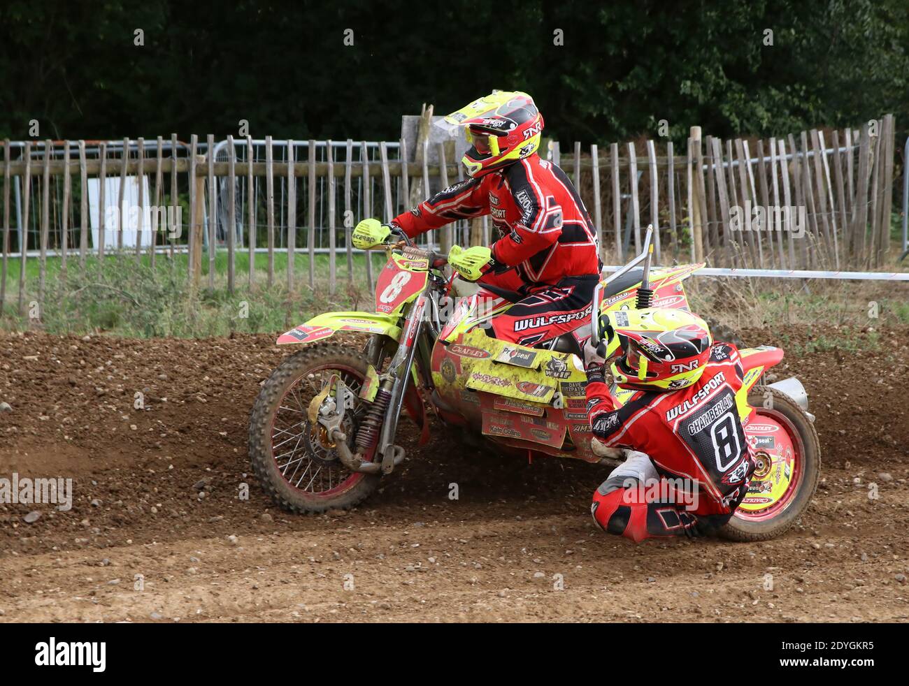 sidecar outfits flying round a bens on a motocross track as they take a bend Stock Photo