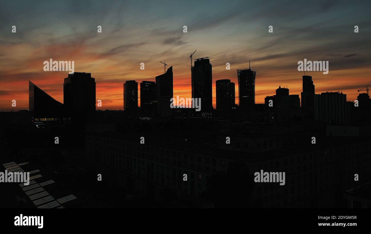 Silhouettes of the buildings in Warsaw on the red sky after sunset ...