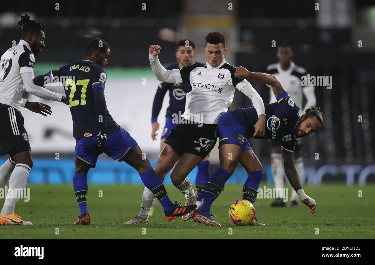 Fulham S Antonee Robinson Centre Battles With Southampton S Ibrahima Diallo Left And Theo Walcott Battle For The Ball During The Premier League Match At Craven Cottage London Stock Photo Alamy