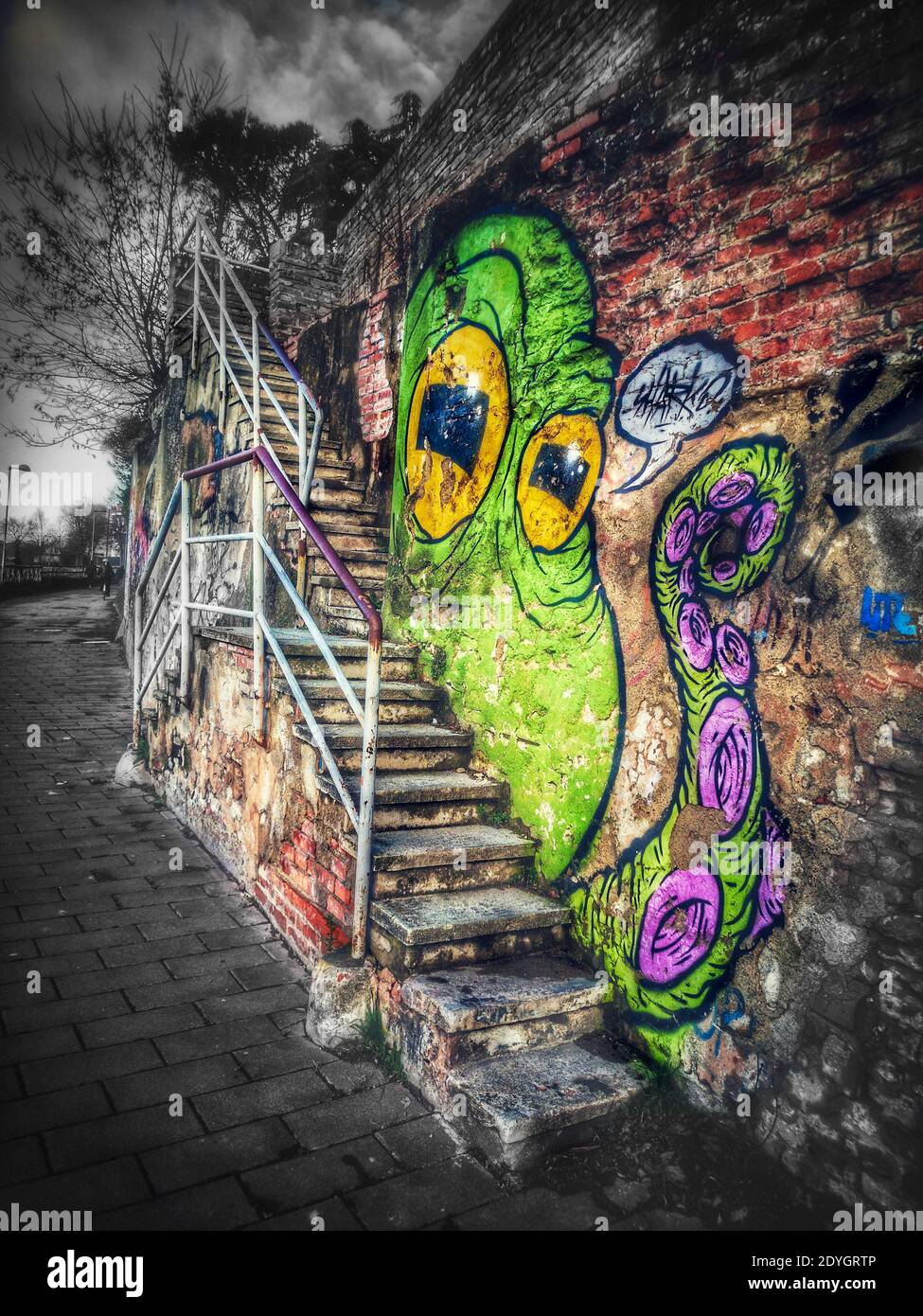 Octopus graffiti art near a city street stair Stock Photo