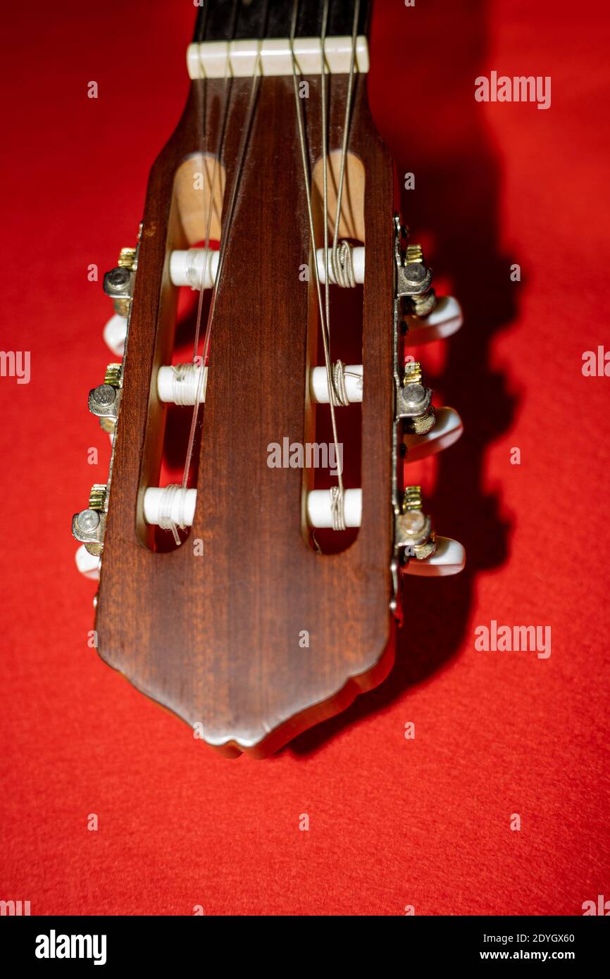 Part of the guitar headstock with the tuning pegs Stock Photo