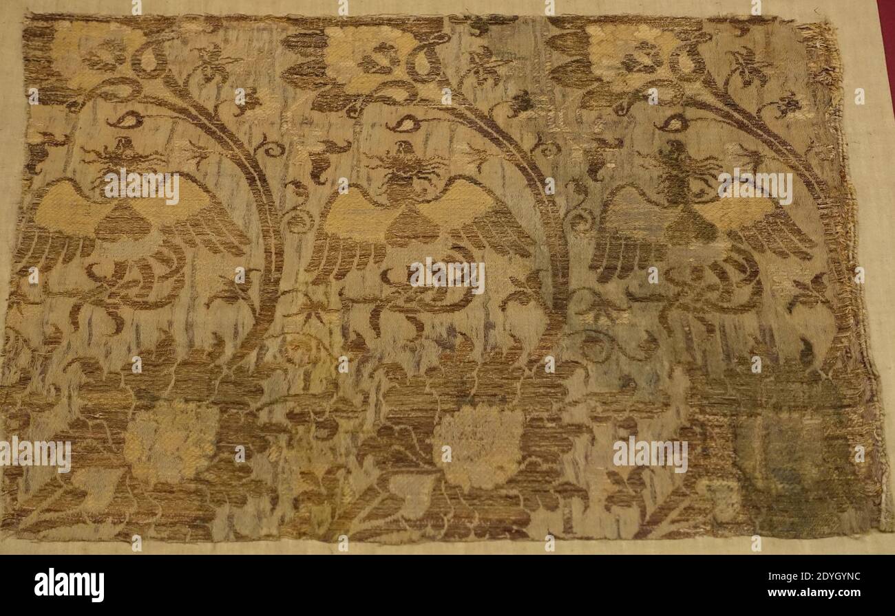 Lampas textile fragment, Italy, 14th century AD, silk with double layer of gold thread Stock Photo