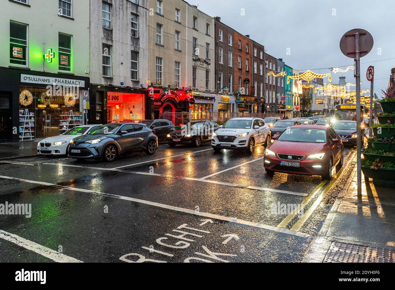 Limerick, Ireland. 26th Dec, 2020. People make their way home after shopping in Limerick before Storm Bella hits the country. Met Éireann has issued a status yellow wind warning for the whole country, which is valid until 6am tomorrow morning. Credit: AG News/Alamy Live News Stock Photo