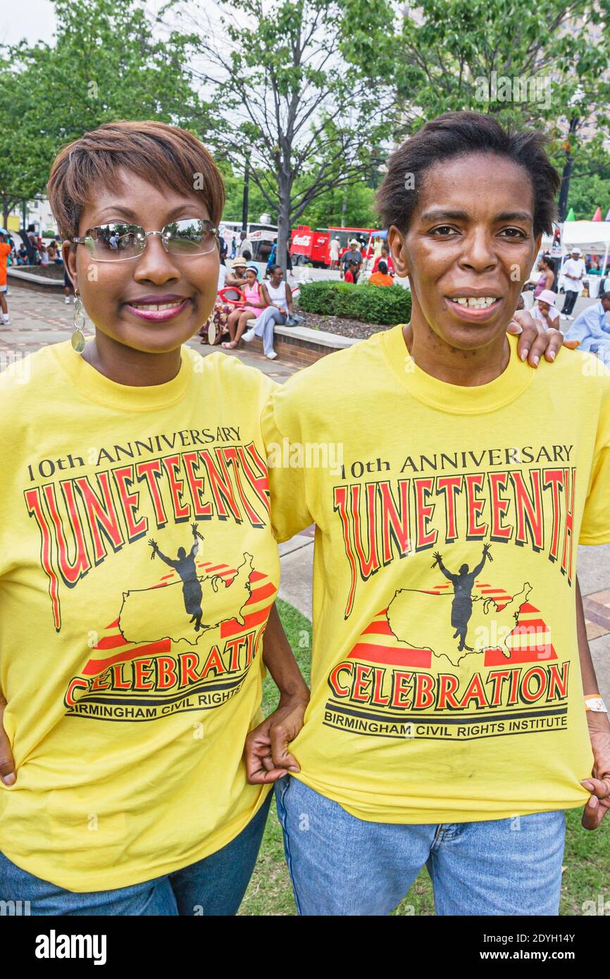 Birmingham Alabama,Juneteenth Celebration Emancipation Day Kelly Ingram Park,Black women friends matching tee shirts, Stock Photo