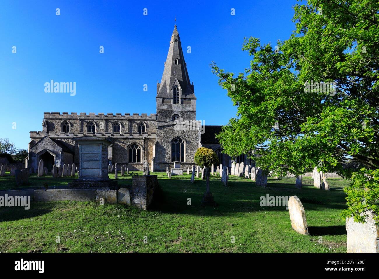 Spring colours over All Saints & St James Church, Kings Cliffe village, Northamptonshire, England, UK Stock Photo