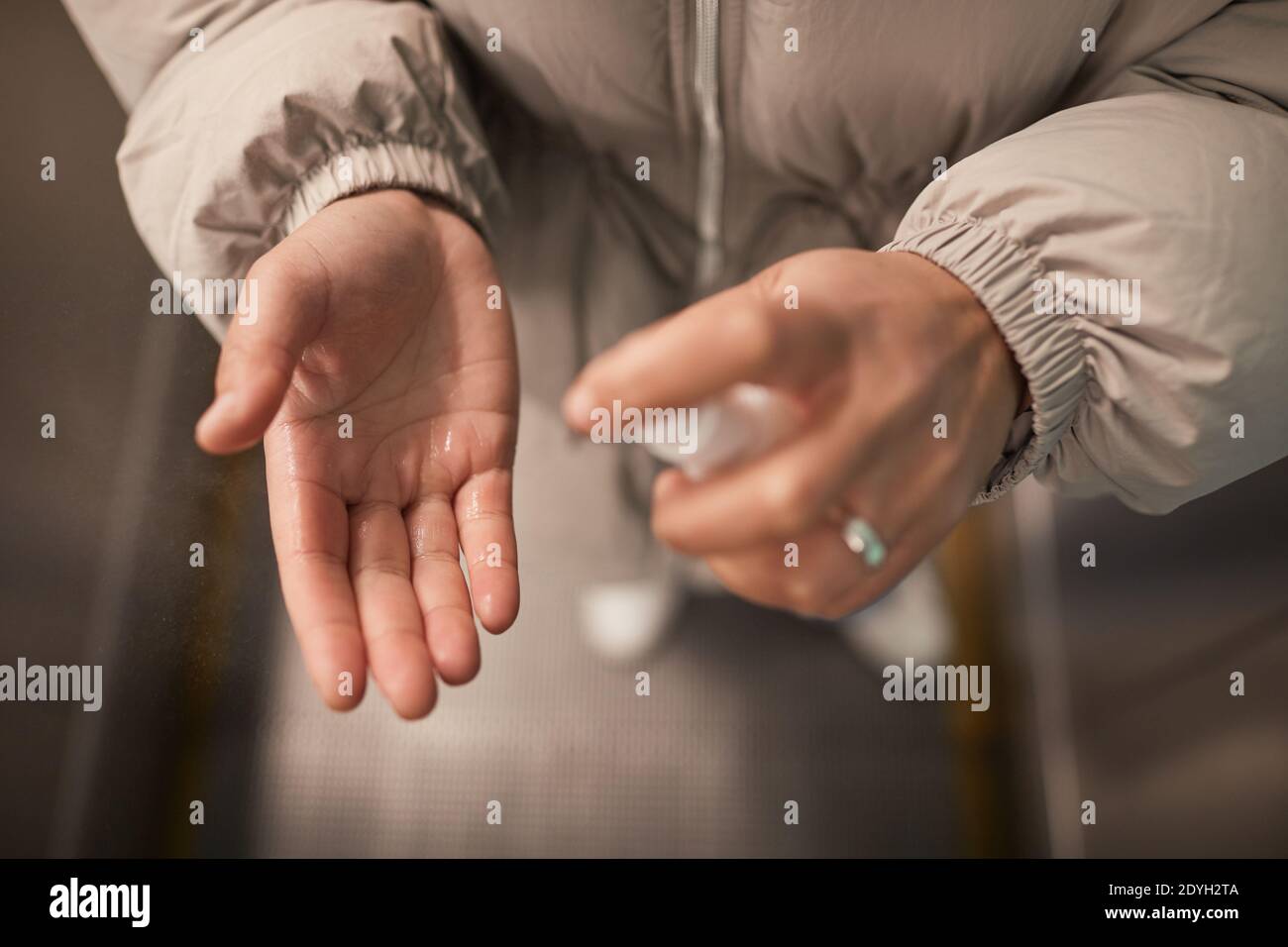 Close-up of woman applying antiseptic on her hands Stock Photo