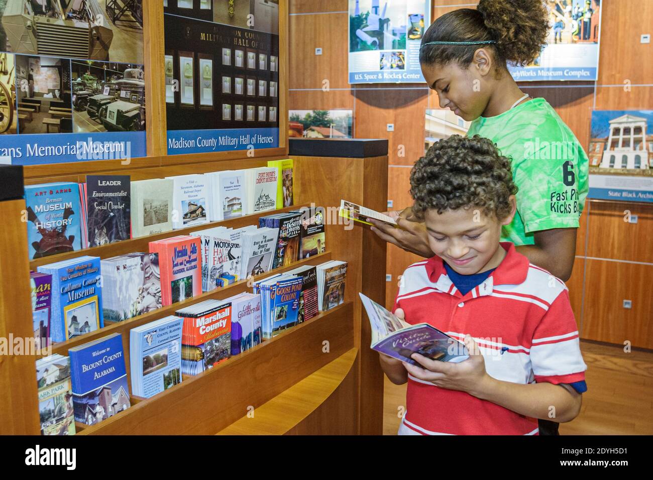 Huntsville Alabama,Visitors Center centre,Black girl boy brother sister siblings looking,brochure brochures folder folders pamphlet pamphlets informat Stock Photo