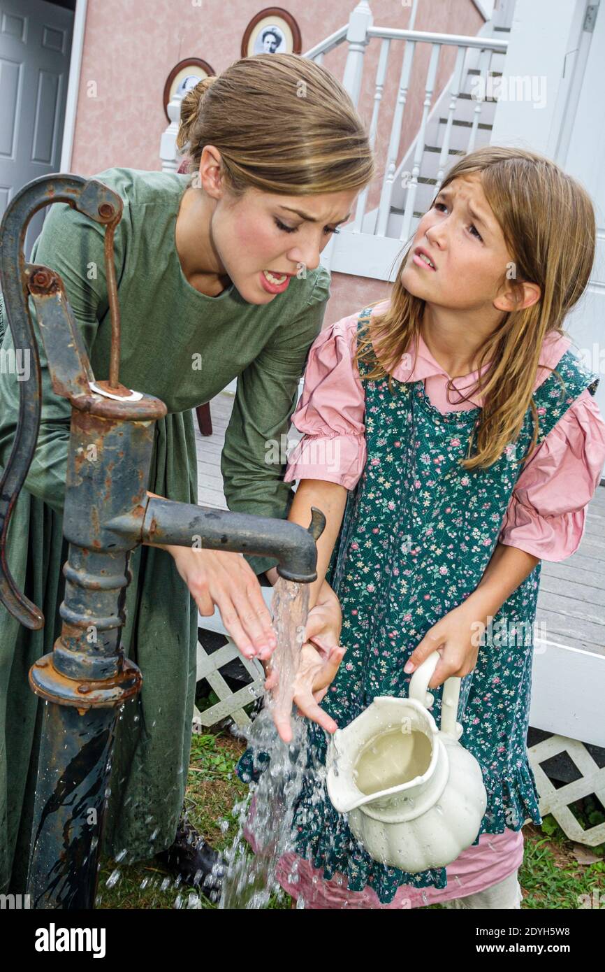 Alabama Tuscumbia Ivy Green Helen Keller birthplace,The Miracle Worker Play actresses acting scene woman,young child girl water pump, Stock Photo