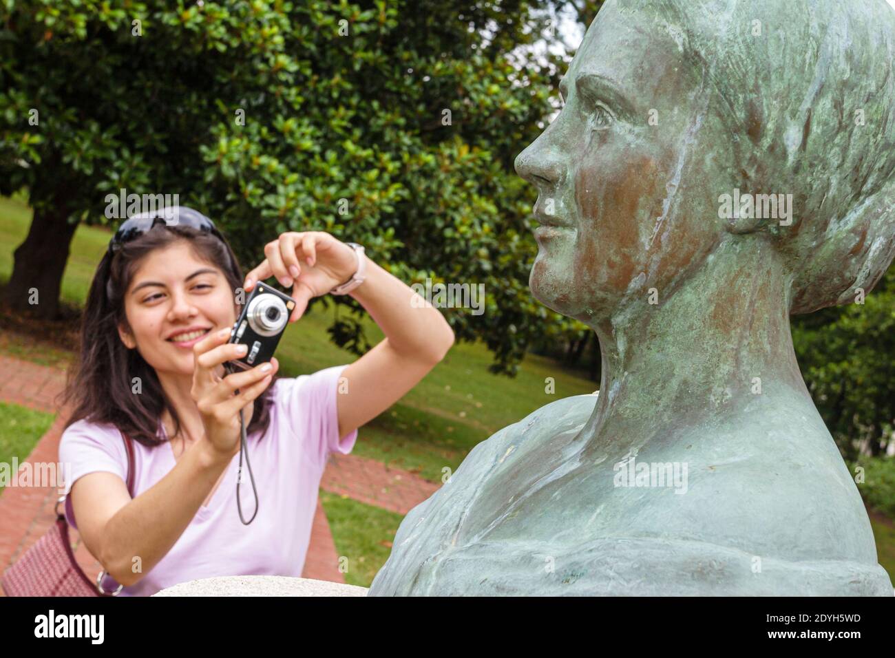 Alabama Tuscumbia Ivy Green Helen Keller birthplace,Asian teen teenage teenager girl taking photo bust, Stock Photo