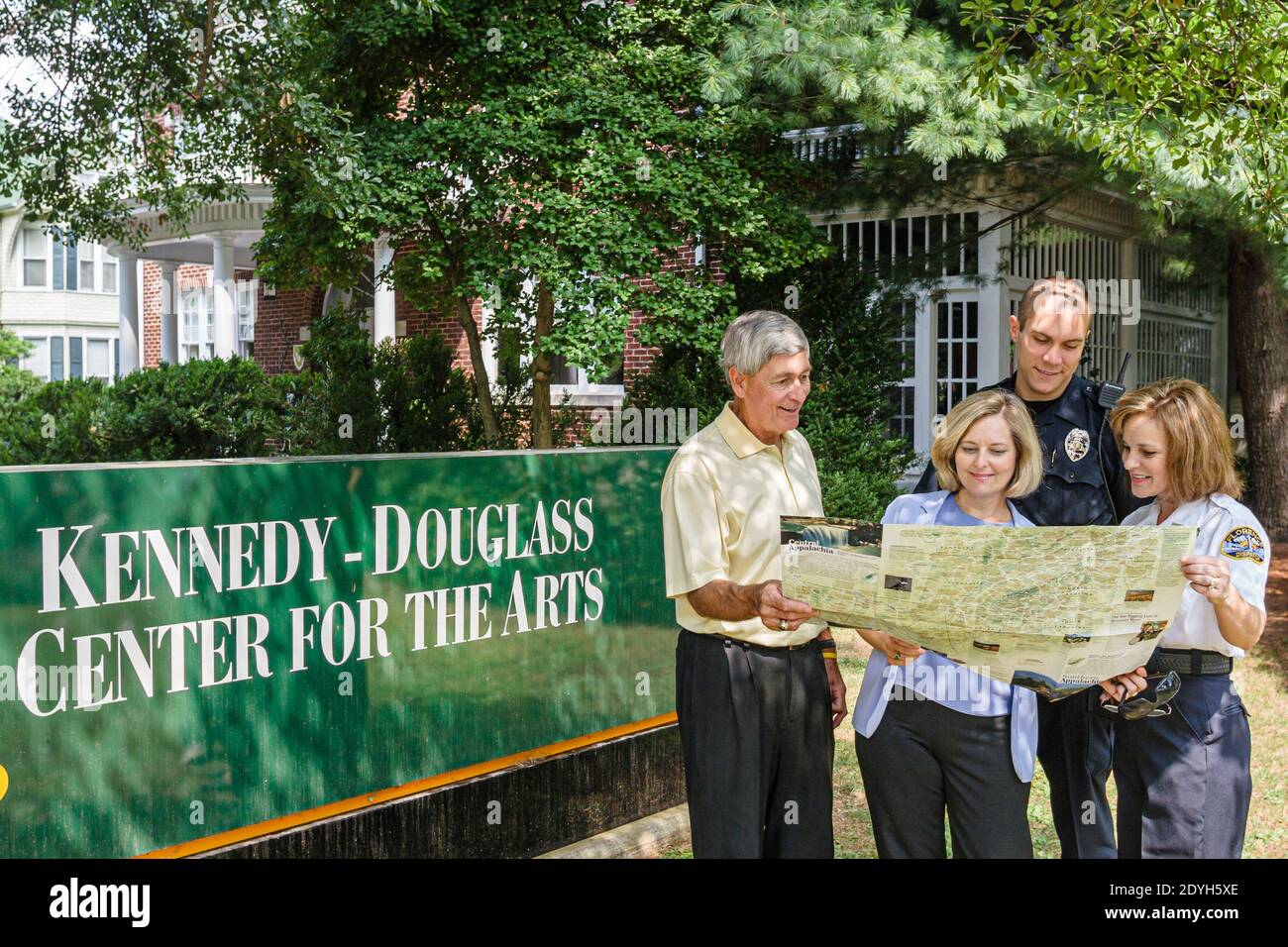 Alabama Florence Kennedy Douglass Center for the Arts,outside exterior police giving directions man woman female couple visiting visitors, Stock Photo