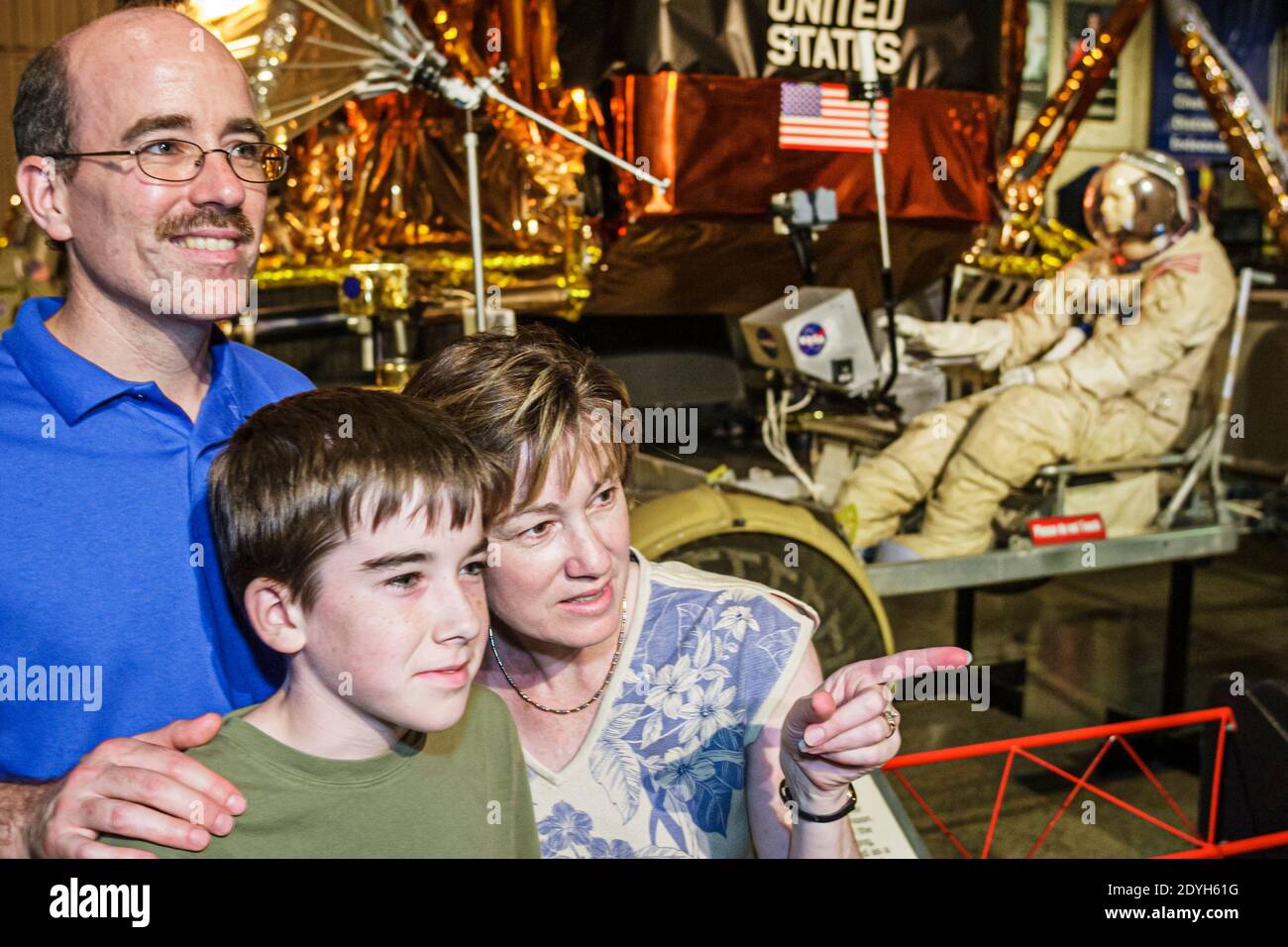 Huntsville Alabama,US Space & Rocket Center centre,Space Camp family parents child mother father boy son,looking lunar landing exhibit, Stock Photo