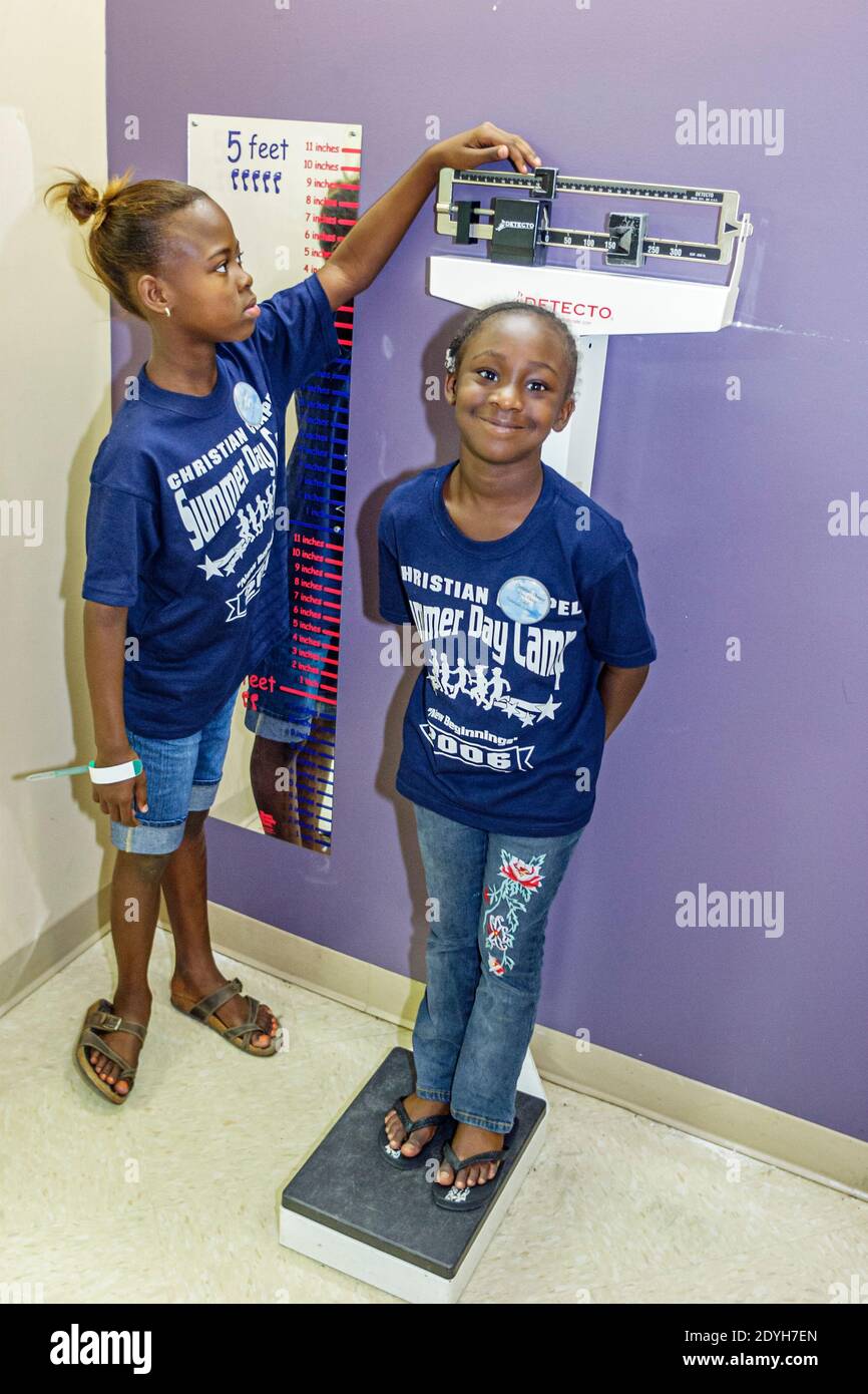 Tuscaloosa Alabama,Children's Hands On Museum,Black student students girls kids children,weighing scale doctor's exam examination room, Stock Photo